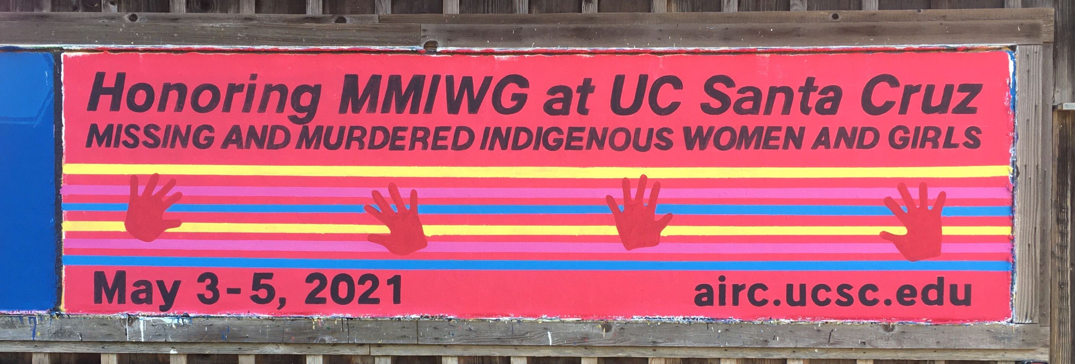 Above is a picture of a hand-painted sign on the barn located at UC Santa Cruz’s campus main entrance to promote the AIRC’s MMIWG virtual event series, 2021 